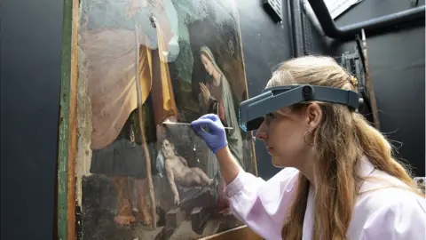 The National Gallery, London Conservation Fellow Olivia Stoddart restoring Peruzzi's 'Nativity