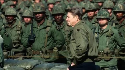 Corbis via Getty Images President Ronald Reagan prepares to speak to US Army troops of the 2nd Infantry stationed in South Korea
