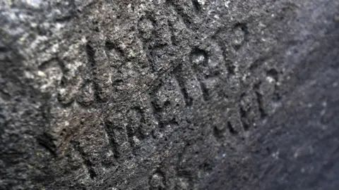 AFP An inscription on a rock in Plougastel-Daoulas, western France.