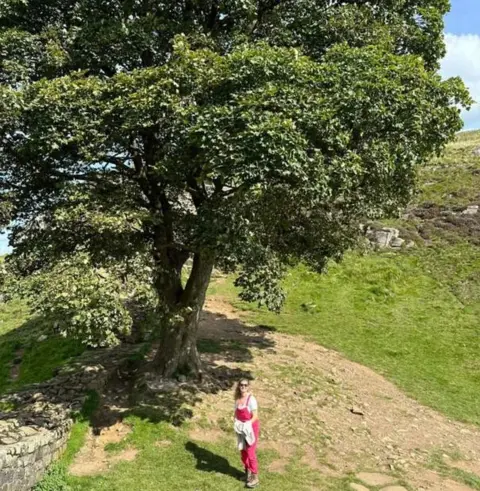 George Richford George's partner Tiggy Brearley in front of the Sycamore Gap tree in August