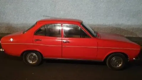 An Garda Síochána red Ford Escort
