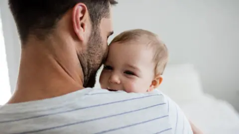 Getty Images Baby and father