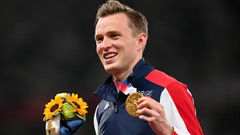 Karsten Warholm with his gold medal at the Tokyo Olympics