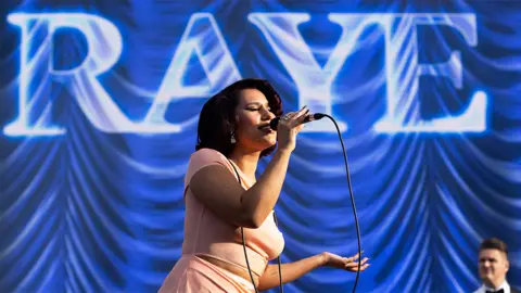 Getty Images Raye on stage at Big Weekend