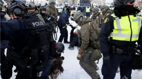 Reuters Police detain a protester in Ottawa on Saturday