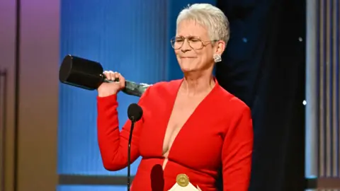 Getty Images Jamie Lee Curtis accepts the Outstanding Performance by a Female Actor in a Supporting Role award for "Everything Everywhere All at Once" onstage during the 29th Annual Screen Actors Guild Awards at Fairmont Century Plaza on February 26, 2023 in Los Angeles, California