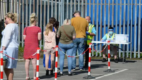 Wales news service Queue outside test unit