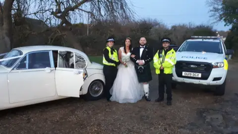 Bedfordshire Police Police officers with the bride and groom