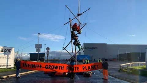 BBC Extinction Rebellion protesters at the Amazon site in Darlington on Friday morning