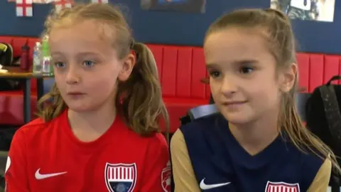 Two girls reacting to England's win