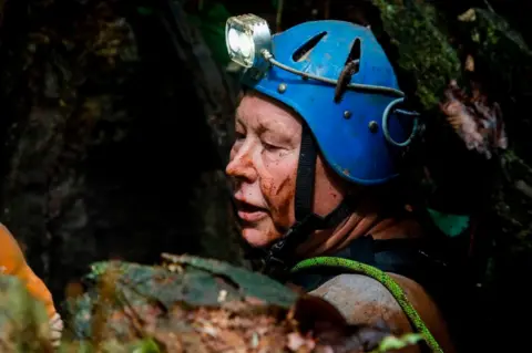 AFP British cave-diver Robert Charles Harper explores an opening in the mountain during the rescue operation