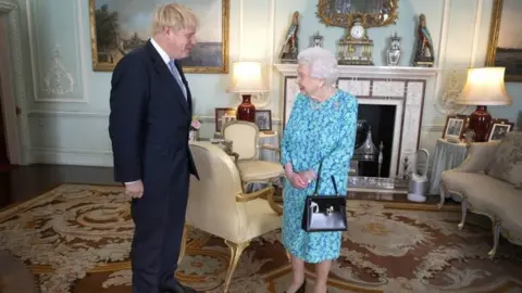 PA Media Boris Johnson and the Queen