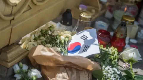 EPA Tributes laid on the banks of the Danube