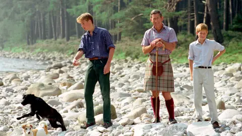 Getty Images Three princes - William, Charles and Harry - by the River Dee on the Balmoral Castle Estate, 1997