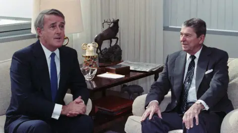 Getty Images Mulroney sitting beside Ronald Reagan