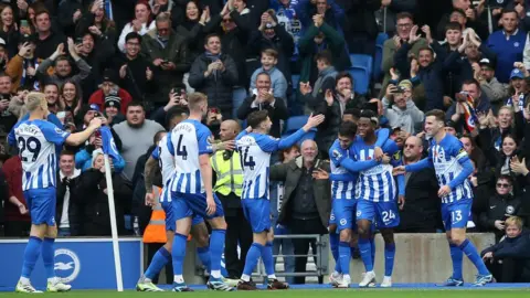 Getty Images Brighton players celebrate