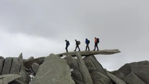 Martin Wales The fab four: Martin Walls captured this Abbey Road inspired scene at the summit plateau of Glyder Fawr, Snowdonia.