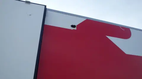 Magpas Air Ambulance A hole on the side of the lorry where fruit was reportedly thrown from.