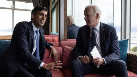 Simon Dawson/10 Downing Street Prime Minister Rishi Sunak talks with US President Joe Biden before a session on the first day of the G7 Leaders Summit