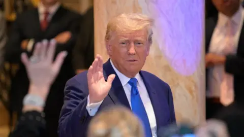 Getty Images Donald Trump waves to supporters in Florida on Tuesday