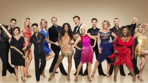 L to R: Davood Ghadami, Susan Calman, Gemma Atkinson, Aston Merrygold, Charlotte Hawkins, Rev Richard Coles, Alexandra Burke, Brian Conley, Debbie McGee, Joe McFadden, Ruth Langsford, Jonnie Peacock, Chizzy Akudolu, Simon Rimmer, Mollie King