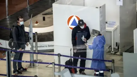 EPA Arrivals at Charles de Gaulle Airport are checked.