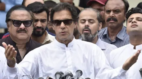 EPA Imran Khan, head of Pakistan Tehrik-e-Insaf (PTI) speaks to journalists after casting his ballot at a polling station during general elections in Islamabad, Pakistan, 25 July 2018.