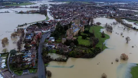 PA Media Flooding around Tewkesbury Abbey, in Gloucestershire