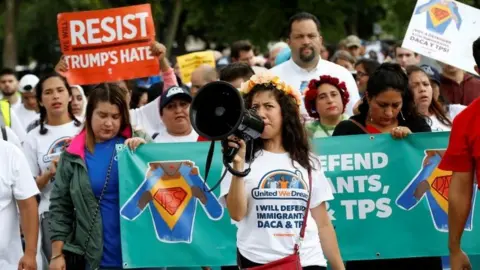 Reuters Demonstrators carrying signs march during a rally by immigration activists CASA and United We Dream demanding the Trump administration protect the Deferred Action for Childhood Arrivals (DACA) program and the Temporary Protection Status (TPS) programs, in Washington, U.S., August 15, 2017.