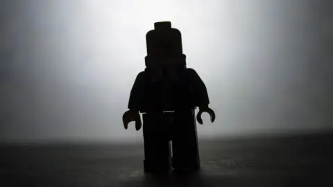 Getty Images Lego figure in silhouette