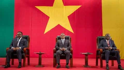 AFP Cameroonian Prime Minister Joseph Dion Ngute (C) attends at the Congress Palace in Yaounde during the opening session of the National Dialogue called by President Biya