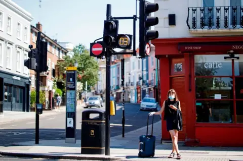 Getty Images woman at road crossing