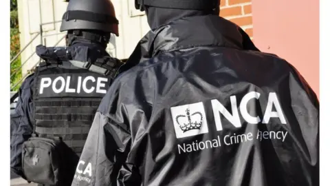 Press Association National Crime Agency officers