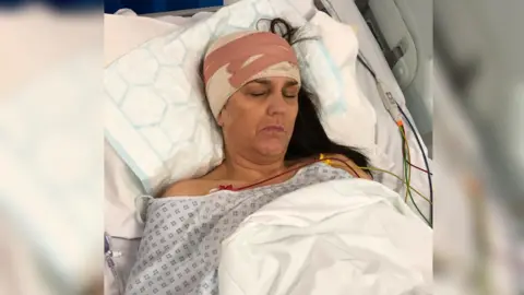 Brain Tumour Research Ms Wingfield recovering in bed after the operations