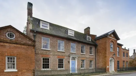 Historic England Exterior general view of north elevation showing central block and west wing. View from north east.