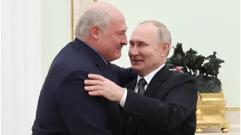 Getty Images Presidents Lukashenko of Belarus (L) and Putin of Russia (R)