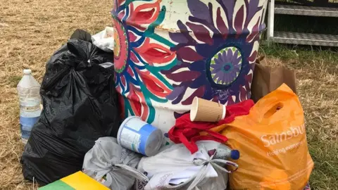 Bags of rubbish in Worthy Farm field