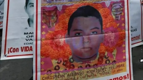 Reuters In this file photo taken on September 26, 2019 people protest in Mexico City to mark five years of the disappearance of the 43 students of the teaching training school in Ayotzinapa