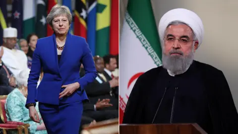 Getty Images/AFP Theresa May and Hassan Rouhani