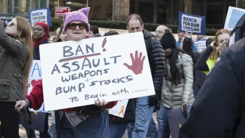 Getty Images A protestor holds a banner at the March for Life in Washington DC, 2018