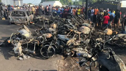 Reuters The shells of burnt out cars and motorcycles left destroyed by Friday's blast