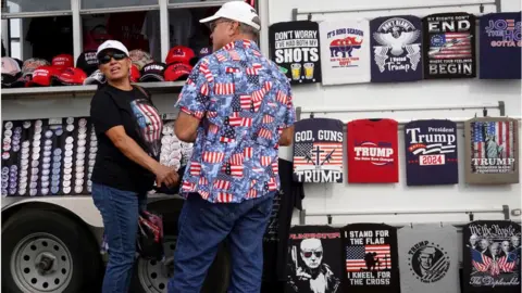 Getty Images Trump gear being sold outside the Iowa rally