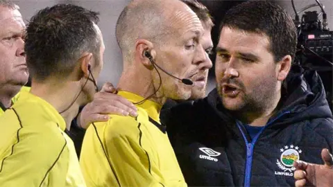 David Healy talks to referee Raymond Hetherington after Linfield's controversial 2-0 defeat by Crusaders