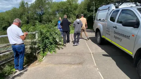 Angling Direct Swindon Environment Agency staff and vehicles at the lake in Swindon