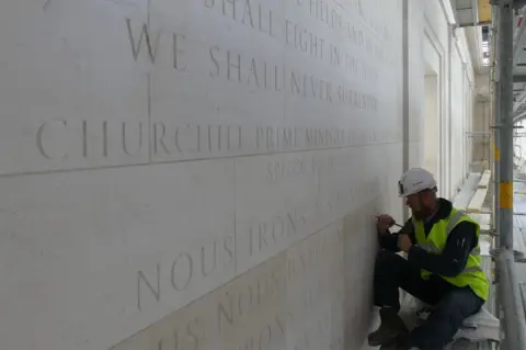 Normandy Memorial Trust A letter carver at work at the British Normandy Memorial