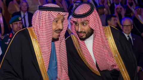 AFP Saudi Arabia's King Salman and his son, Crown Prince Mohammed bin Salman, speak at the opening of the Diriyah Gate touristic project in north-western Riyadh (20 November 2019)