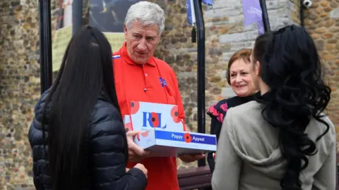 Wales News Service Poppy seller Peter Wilson