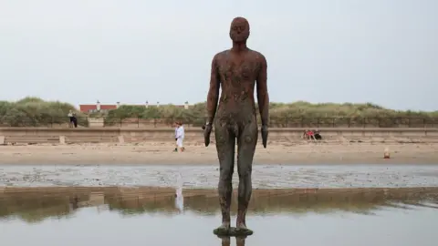 Reuters Statue "Another Place" by Antony Gormley on Crosby beach