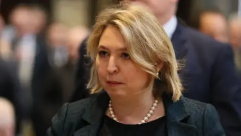 Getty Images Karen Bradley, Northern Ireland Secretary of State, at the funeral of Lyra McKee.