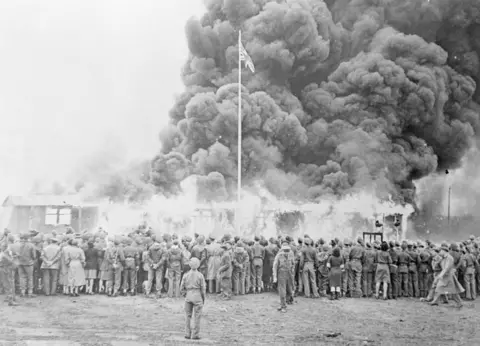 Bettmann / Getty images Last hut burnt down at Belsen
